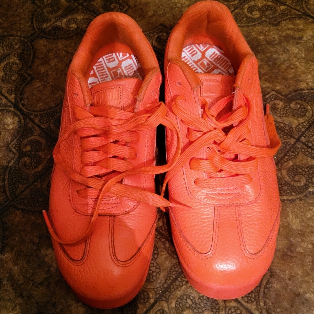 Orange/red Puma sneakers